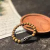 Pulseira de Dzi de Nove Olhos em Sândalo Natural de Círculo Único para Homens e Mulheres, Pulseira de Rosário com Contas de Madeira de Sândalo para o Ano de Nascimento