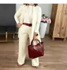 Estación Independiente Transfronteriza Europea y Americana 2025 Conjunto de 3 Piezas para Mujer: Top de Color Sólido con Cuello Redondo y Mangas Largas con Cinturón y Pantalones Cómodos
