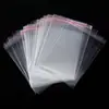 Bolsas OPP autoadhesivas del fabricante en stock, bolsas transparentes de embalaje para ropa, bolsas de plástico a prueba de polvo para joyería y accesorios, se pueden imprimir