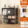 Gabinete de revistas negro minimalista con puerta abatible, mesita de noche artística, estante para robot aspirador estilo Bauhaus para sala de estar, dormitorio