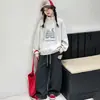 Conjunto de otoño para niña 2026 nuevo sudadera de moda estilo coreano con media cremallera y cuello alto y pantalones deportivos casuales para primavera y otoño