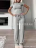 Comercio exterior transfronterizo Ropa europea y americana para mujer Primavera y verano 2024 Traje de moda de color liso con cuello redondo, temperamento urbano de ocio