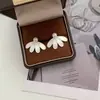 Pendientes de Aguja de Plata 925 Estilo Chino Nuevo Pétalo Cepillado Rosa Manta Perla para Mujer, Pendientes Elegantes de Nicho de Lujo Ligero