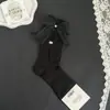 Novas meias de cano médio vazadas com strass e laço doce, meias da moda feminina, meias largas de celebridade da internet mais vendidas para primavera-verão