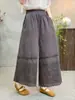 Estilo nuevo de verano estilo chica Mori artístico cintura elástica color liso diseño de retazos huecos pantalones rectos holgados versátiles al por mayor