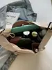 Bolsa Casual Versátil Leve de Grande Capacidade Transfronteiriça em Formato de Chifre para Mulheres Novo Modelo 2026 Bolsa Meia-Lua Bolsa de Ombro Transversal de Nicho