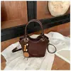 Bolso de mano para mujer estilo coreano transfronterizo 2026 nuevo bolso versátil bolso cubo retro simple bolso de hombro cruzado