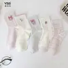 Calcetines para niñas Yishuangshuang, nuevos calcetines de otoño e invierno con forma de corazón de dibujos animados hasta la mitad de la pantorrilla, algodón peinado, calcetines estilo Miu con letras y caras sonrientes para estudiantes