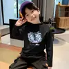 Ropa interior térmica base para niños 2026 Nueva Ropa Otoño/Invierno Cuello semi-alto Camiseta de manga larga para niños Top cepillado De Rong Tendencia