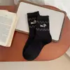 Calcetines de media pantorrilla de dibujos animados de cachorro Fair Isle para mujer Otoño e Invierno Ins Estilo Japonés Simples Versátiles Calcetines de felpa Combinación de colores gris y azul