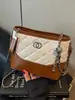 Bolso de hombro con cadena de patrón de diamante para mujer, nueva moda trendy 2026, bolso de hombro y bandolera de alta gama para el día a día, bolso tipo cubo