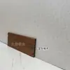 Fabricantes producen rodapié de madera de fibra de bambú de cristal de carbono negro ignífugo de 8 cm, panel de pared integrado de chapa de madera, línea de esquina al por mayor