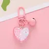Llavero Colgante Creativo de Campana de Corazón Pequeño Fresco Color Roto Corazón de Melocotón Anillo de Pintura Accesorios Set de Auriculares Decoración de Bolsa