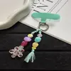 Nueva cadena para teléfono, llavero y charm para bolso de estilo ins floral tejido con borlas