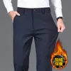 Calça casual elástica para exportação de comércio exterior para homens, novo outono e inverno de 2026, corte reto solto, calça masculina para terno de negócios de meia-idade