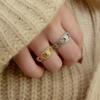 Anillo hueco abierto micro-incrustado de circonita europea y americana, viento celi de lujo ligero francés, pulsera con patrón del Arco del Triunfo para mujer