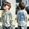Camiseta de manga larga de punto gofre para niños, nuevo estilo primavera y otoño 2026, suéter para bebé, camiseta de dos en uno de moda para niños mayores