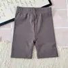 Ropa infantil coreana 2026 verano nuevo estilo bebé color caramelo alta elasticidad pantalones de ciclismo leggings para niñas pantalones de yoga