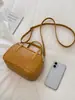 Nueva colección de otoño 2026: un bolso bandolera versátil, un bolso tote de moda, un bolso tipo almohada elegante y un bolso tejido retro chic, de nicho, para mujer