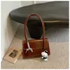 Bolso pequeño de alta calidad, con textura, estilo vintage para mujer, nueva colección 2026, versátil para el trabajo, bolso de hombro, bolso de axila y bolso tote pequeño