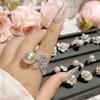 Camélia Super fada elegante elegante elegante flor de pérola anel diário requintado incrustado de diamante Anel francês vintage feminino