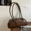 Bolsa de ombro transversal 2026 de alta costura, versátil para o dia a dia, moderna, simples, nicho, casual, para o trabalho, bolsa baguette