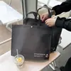 Sacolas de compras ecológicas de TNT com fivela para lojas de roupas, sacolas espessadas para vestuário masculino e feminino, embalagem por atacado, novo material para compras