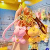 Nuevo Llavero Creativo de Oso con Cara de Garabato para Mujer, Lindo y a la Moda, Exquisita Muñeca de Resina, Llavero Colgante para Mochila Escolar