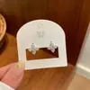 Pendientes de trébol de cuatro hojas con incrustaciones completas estilo ins coreano para mujer, lujo ligero, exquisitos, versátiles, de nicho, alta gama, adecuados para ir al trabajo, venta al por mayor