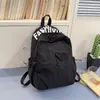 Mochila de nailon simple y ligera para mujer, estilo coreano, gran capacidad, adecuada para estudiantes de secundaria y preparatoria, bolso de viaje casual y versátil