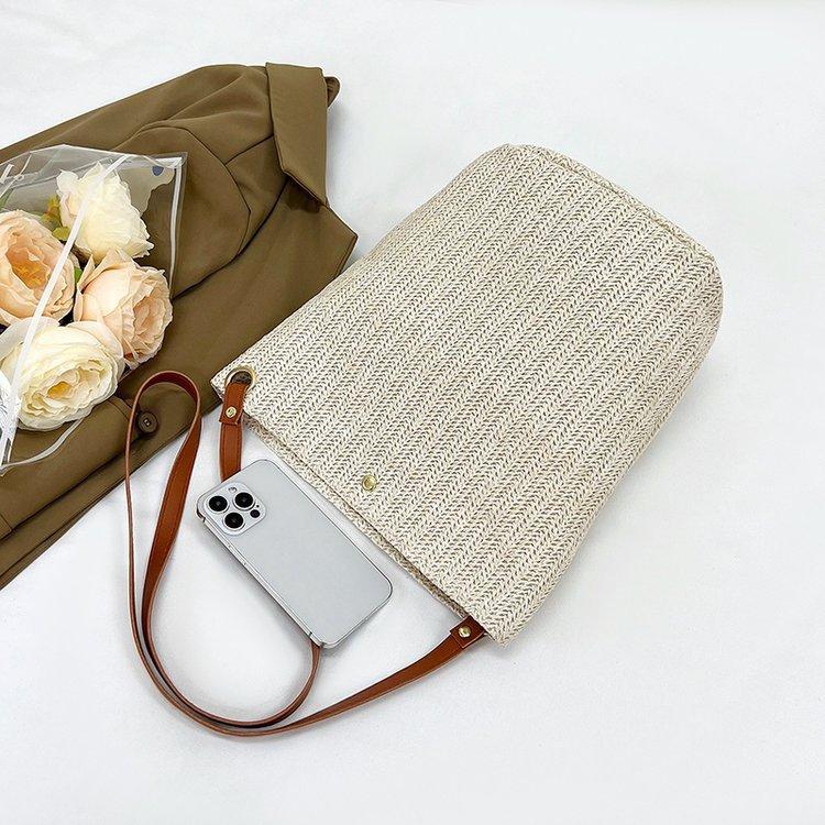 编织包女包新款潮2024夏草编简约百搭小清新水桶包个性单肩斜