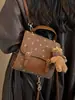 Mochila de Moda de Gama Alta con Bloques de Color para Mujer 2026 Nueva Versátil Casual Mochila de Espalda Multifuncional Pequeña para Viajes Escolares