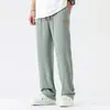 Pantalones Casuales para Hombre Primavera y Otoño 2026 Nuevo Estilo Holgado Caída Pierna Recta de Moda Marca Ins Pantalones Deportivos Color Sólido con Parche