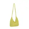 Versión coreana 2026 nueva bolsa tejida simple versátil hecha a mano, bolsa de dumplings para vacaciones, bolso de hombro de nicho, bolso de mujer de moda