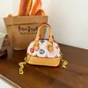 Bolso Pequeño de Mano PU de Diseño de Nicho de Moda para Mujer, Bolso de Hombro Único, Bolso Cruzado de Personalidad Otoño 2026, Bolso Tipo Concha