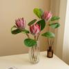 Simulación de alta gama Flor Emperador flocado tamaño pequeño Flor Emperador Lan decoración de mesa de comedor de hotel accesorios de arreglo floral flor artificial al por mayor