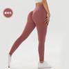 Nuevo traje de yoga sin costuras de color sólido para fitness, ropa exterior de cintura alta, pantalones ajustados deportivos de color melocotón para abdominales y caderas.