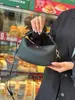 Bolsa de Maquiagem de Couro Genuíno com Textura TOGO de Primeira Camada, Nova e Fashion, Bolsa Pequena Transversal para Ombro Feminina, Tendência Transfronteiriça