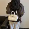 Bolsa de Grande Capacidade Feminina Versátil 2026 Nova Casual Transversal de Ombro de Braço Bolsa Tote de Mão Popular Deste Ano