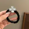 Diadema de moda de lujo ligero con trébol de cuatro hojas de diamantes de imitación para mujer, nueva banda elástica versátil y elegante con alta elasticidad