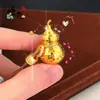 Libro Rojo Pequeño Mismo Estilo Oro Arena Brillante Escama de Dragón CNC Bolsita Colgante Calabaza, Colgante de Calabaza Rompehielo Abrible