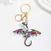 Nuevo colgante vintage colorido con forma de dragón transfronterizo, accesorio de llavero para pareja de hip-hop resistente europeo y americano con incrustaciones de diamantes
