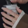 2025 Nova Moda Versátil Anel Brilhante de Diamante Quatro Estrelas Vento Frio Simples Nicho Anel de Dois Dedos Positivo e Reverso