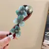 Pinza para el pelo retorcida de perlas con forma de flor para mujer, estilo de alta gama, nuevo modelo 2025, pinza para moño informal para la parte trasera de la cabeza, pasador