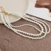 Collar de perlas barrocas vintage multicapa para mujer, diseño nicho de lujo ligero, cadena de clavícula de alta gama, accesorios de collar apilados