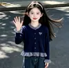 Conjunto de Ropa de Otoño para Niñas 2026 Nuevo Conjunto de Dos Piezas con Top a Cuadros y Bloques de Color y Jeans para Niños Mayores en Estilo Chic