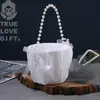 Nuevo Cesta de flores para dama de honor y florista de estilo occidental, mango de flor y perla, cesta de flores romántica, suministros para bodas, ventas directas de fábrica