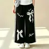 Conjunto de Dos Piezas para Niña: Polo Delgado con Bloques de Color de Manga Corta 2026 Verano Moda Coreana Pantalones Casuales con Lazo de Encaje