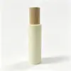Botella de vidrio beige de hombro plano, botella de spray vacía de 100 ml, botella de loción de agua de esencia, en stock para venta al por mayor, entrega rápida de muestras