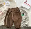 Pantalones de pana de color liso para primavera y otoño para niño, nuevo estilo, pantalones casuales para niña, pantalones holgados para bebé que combinan con todo.